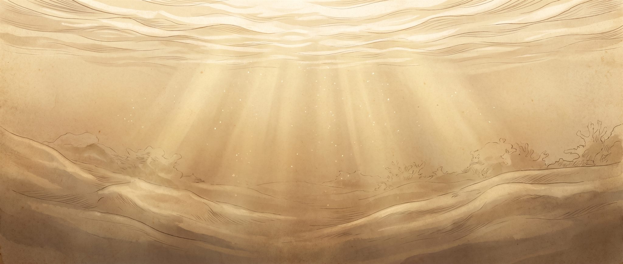 Just beneath the ocean surface: golden light rays reach down through warm, clear water.